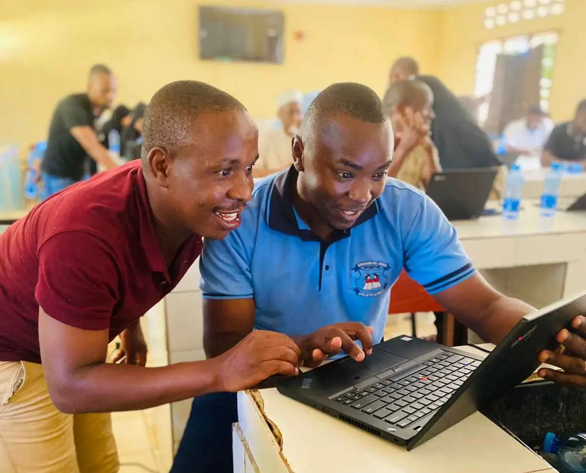 Mr. Cosmus and Mr. mwiti at Shikaadabu Secondary School